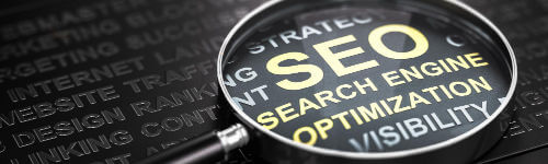 A magnifying glass with the words seo search engine optimization.