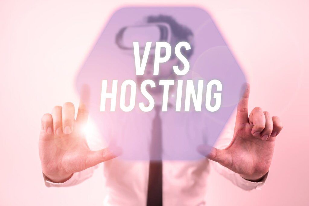 A person in business attire touches a transparent screen displaying the words "VPS Hosting" in large white letters, highlighting the concept of what is virtualization in modern business technology.