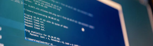 A close-up of a computer screen displaying lines of code, network statistics, and ZFS commands in a command line interface.